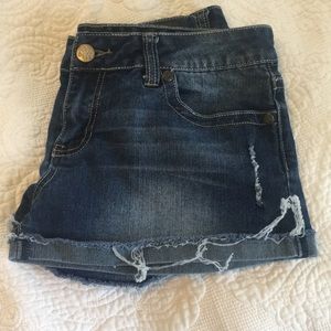 Jean shorts with frayed rolled up legs